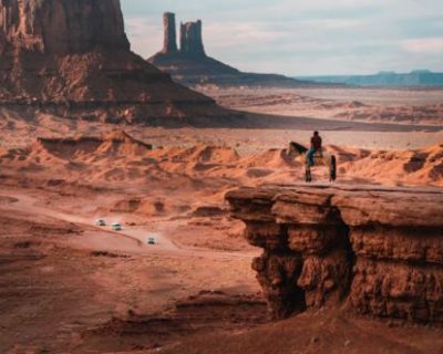 RS15313_nik-shuliahin-oKZDdU5g7BQ-unsplash-man-on-a-horse-over-looking-navajo-nation-in-monument-valley 