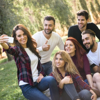 girl-taking-picture-with-her-friends-park_1139-604